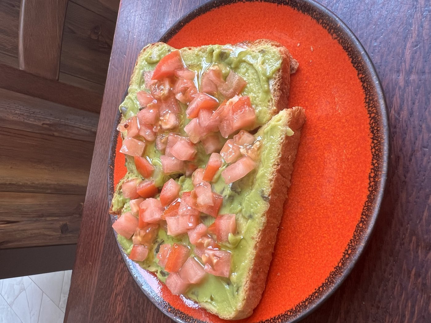 Avocado toast topped with fresh diced tomato at Tino's Tazza, Kingston NJ