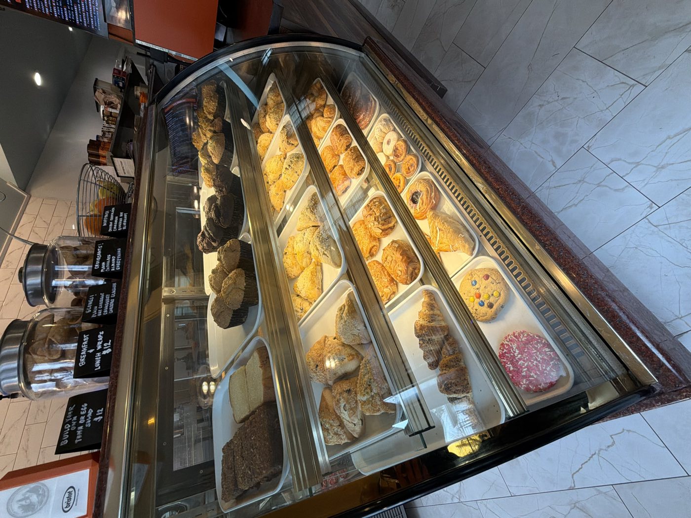 Fresh-baked pastries, scones, croissants and cookies in the bakery display case at Tino's Tazza in Kingston, NJ