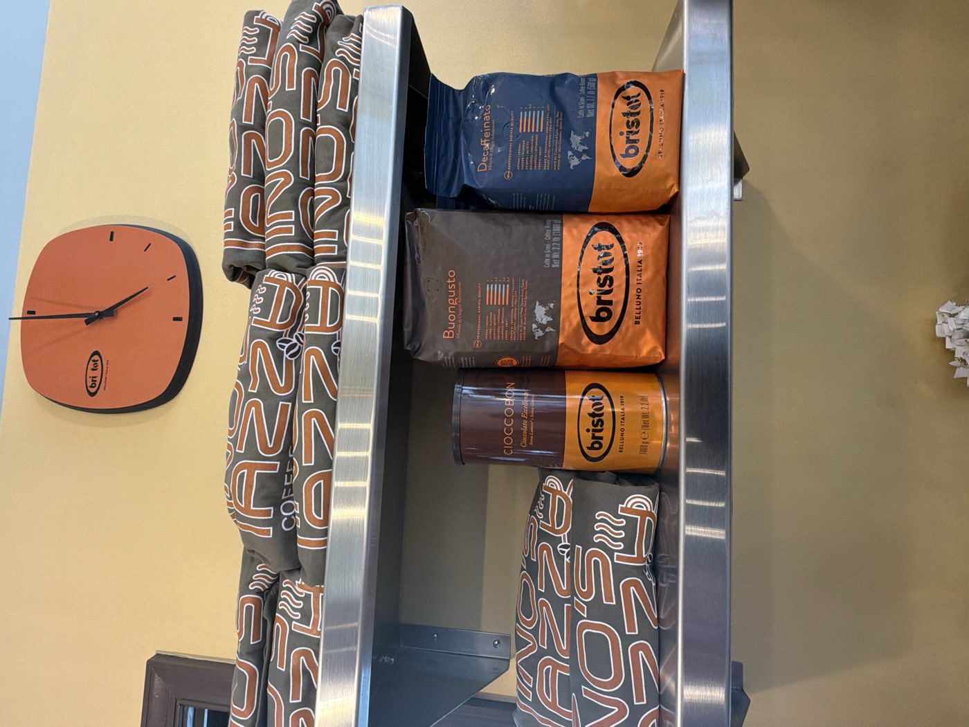 Bristot Italian coffee and Tino's Tazza branded merchandise on the shelf in Kingston, NJ