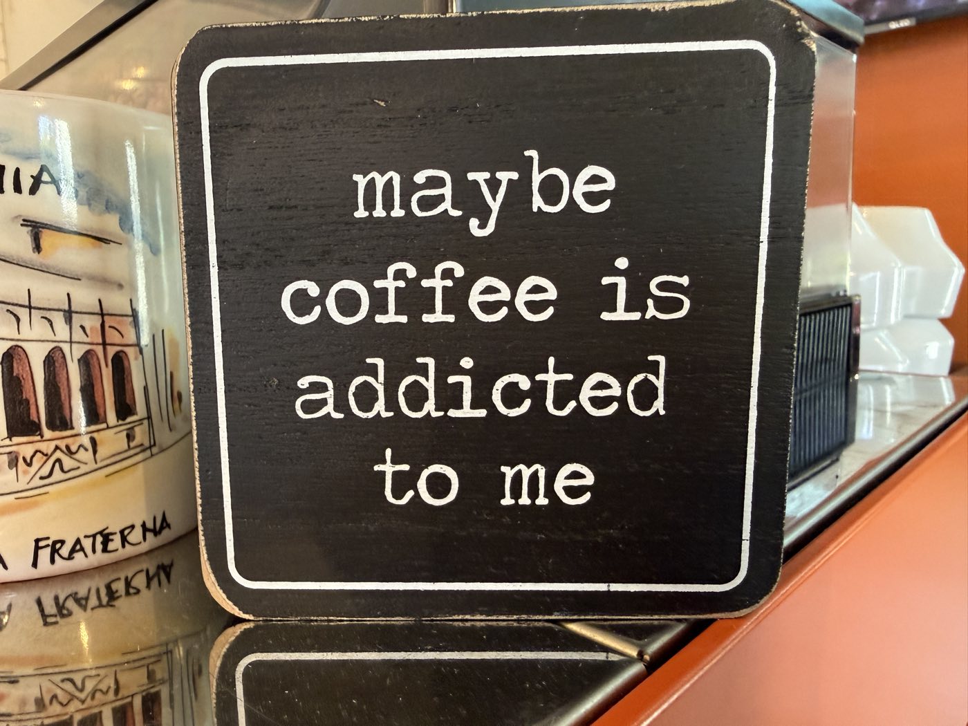 A sign reading maybe coffee is addicted to me at Tino's Tazza, Kingston NJ